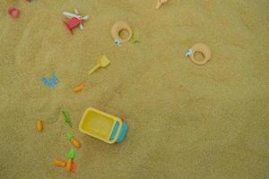 selective focus on children's truck toys on synthetic sand made from seeds, children's playgrounds. soft focus photo