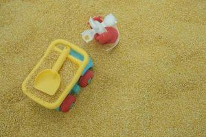 selective focus on children's truck toys on synthetic sand made from seeds, children's playgrounds. soft focus photo