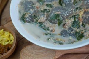 selective focus on food kapurung is a soup with a slightly sour and fresh taste originating from Sulawesi, this food is made from sago flour or starch with fish water broth, soft focus photo