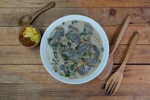 selective focus on food kapurung is a soup with a slightly sour and fresh taste originating from Sulawesi, this food is made from sago flour or starch with fish water broth, soft focus photo
