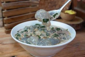 selective focus on food kapurung is a soup with a slightly sour and fresh taste originating from Sulawesi, this food is made from sago flour or starch with fish water broth, soft focus photo