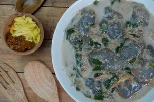 selective focus on food kapurung is a soup with a slightly sour and fresh taste originating from Sulawesi, this food is made from sago flour or starch with fish water broth, soft focus photo