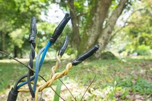 selective focus on broken cable connections and insulation using duct tape, the concept of safety in electrical hazards photo