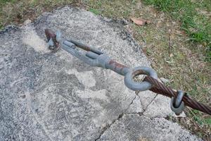 selective focus on metal lanyards and hooks used to pull and strengthen wire slings that hold up bridges or building construction photo