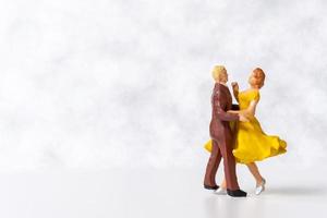 Miniature Couple dancing on dance floor , International dance day concept photo