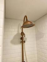 close up classic and retro style shower head. gold color classic shower head photo