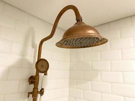 close up classic and retro style shower head. gold color classic shower head photo