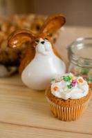 little Easter cake on the wooden table of the house photo