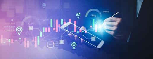 Hand touchscreen line of Stock market or forex trading graph and candlestick chart suitable for financial investment concept,Economy trends background for business idea and all art work design. photo