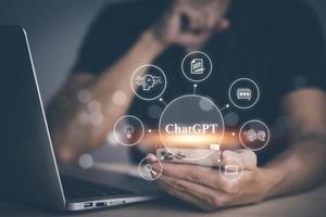 Man using Laptop and touch bar Chat bot Chat with AI, Artificial Intelligence, System Artificial intelligence an artificial intelligence chatbot, Digital chatbot, Robot application, conversation photo