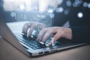 Man using Laptop and touch bar Chat bot Chat with AI, Artificial Intelligence, System Artificial intelligence an artificial intelligence chatbot, Digital chatbot, Robot application, conversation photo
