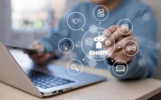 Man using Laptop and touch bar Chat bot Chat with AI, Artificial Intelligence, System Artificial intelligence an artificial intelligence chatbot, Digital chatbot, Robot application, conversation photo