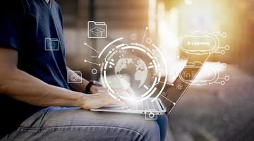 Concept E-learning education,Man using laptop with Online Education icon on virtual screen. video internet lessons and online webinar, online lessons on a digital screen.Education internet Technology. photo