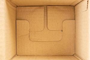 Open empty brown cardboard box background top view photo