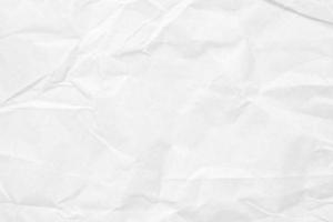 Abstract white crumpled and creased recycle paper texture background photo