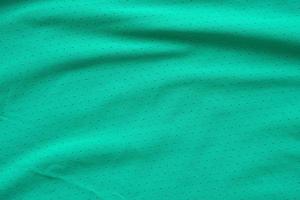 Green sports clothing fabric football shirt jersey texture background photo