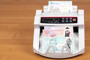 Scottish money in a counting machine photo