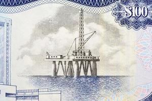 Offshore oil platform from money of Trinidad and Tobago photo