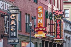 Nashville, Tennessee. USA. February 13, 2023. Three neon signs in downtown Nashville, Tennessee. photo