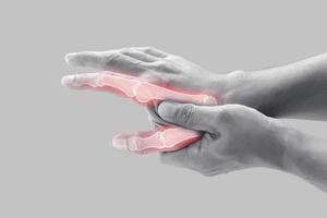 Man having bone pain in index finger and thumb. photo