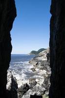 Coastline through the gap of cliffs photo