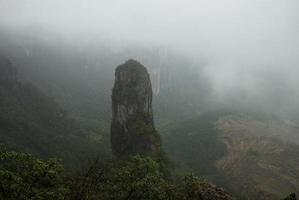 Mountain peak with a very interesting shape in fogs photo