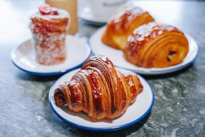 Croissant in a white small plate photo