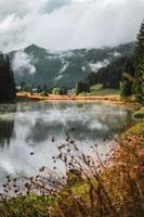 Lac de Morgins in winter with mountains covered in snow, Pas de Morgins photo