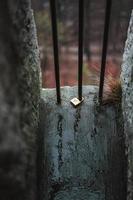 Love lock laying on the ground with a heart on it and rain photo