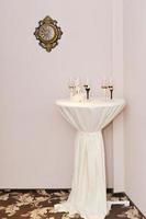 champagne glasses arranged on the table for wedding reception photo