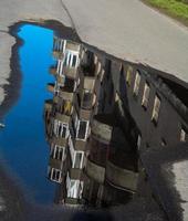 reflection of the house in the spring puddle photo