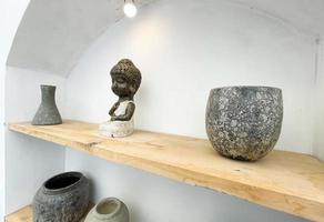 Small statue decorations for table and interior, little buddha statue modern simplistic house environment photo