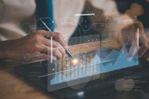 Statisticians read data through digital charts and screen interfaces ,to analyze and improve corporate strategy ,Manage financial and marketing documents, Company Growth Data Statistics Graph photo