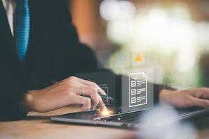 Businessman checking the steps through a virtual online document with a list of checkboxes Concepts of practices and policies, company articles of association Terms and Conditions, Finding errors. photo