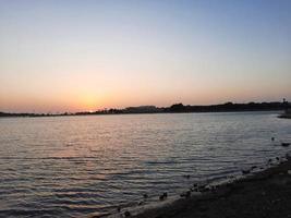 Beautiful evening and colorful sunset at Jeddah corniche. photo