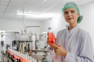 quality supervisor or food or beverages technician inspection about quality control food or beverages before send product to the customer. Production leader recheck ingredient and productivity. photo