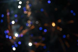 On a black background bokeh from explosions of colorful fireworks. photo