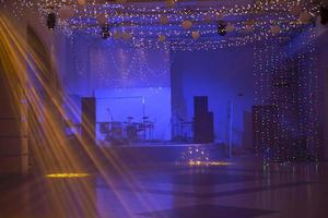 Night empty stage with musical instruments and spotlights. photo