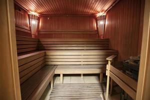 Interior of a modern wood-fired sauna. Steam room. photo