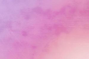 Blurred vintage pink gradient background with spots and scratches. photo