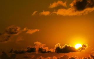 Colorful golden sunset big wave and beach Puerto Escondido Mexico. photo