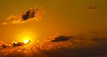 Colorful golden sunset big wave and beach Puerto Escondido Mexico. photo