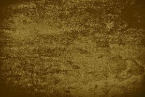 Blurred vintage retro brown background with stains and scratches. Old dark paper. photo