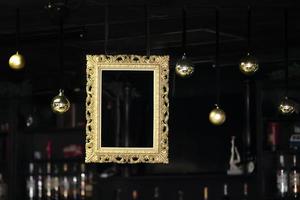 Christmas bar interior with golden frame and baubles. photo