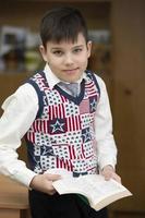 Schoolboy, middle school student with a book. photo