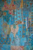 Blurred ethnic oriental fairy tale pattern in blue tones. photo