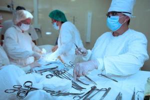 Surgeons during the operation. Professional doctors performing surgeries. photo