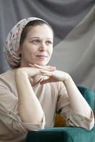 Portrait of a beautiful middle-aged woman in a turban. An Israeli woman in a traditional headdress. photo