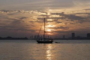 A sailboat on Lake Ontario at sunset photo