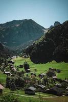 Wooden hut in the alps with mountains in the background Panorama photo